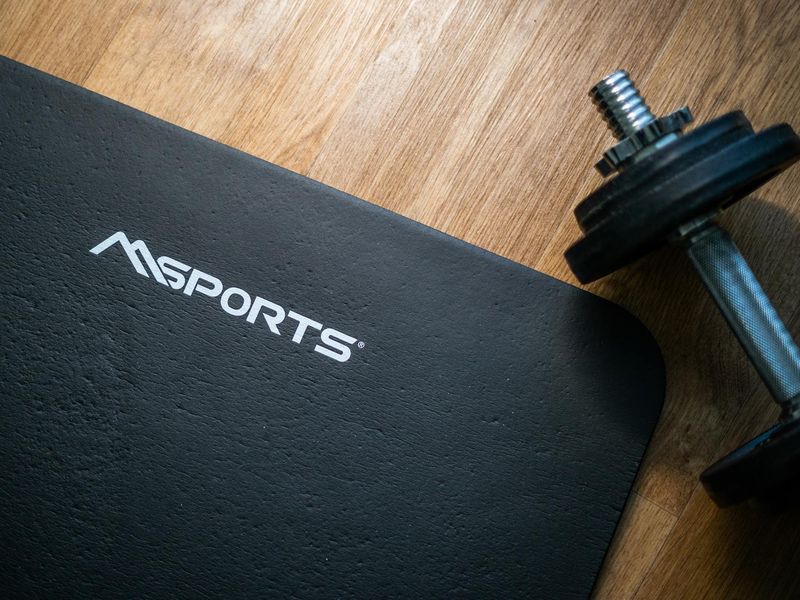 Modern minimalist home gym with exercise mats and weights