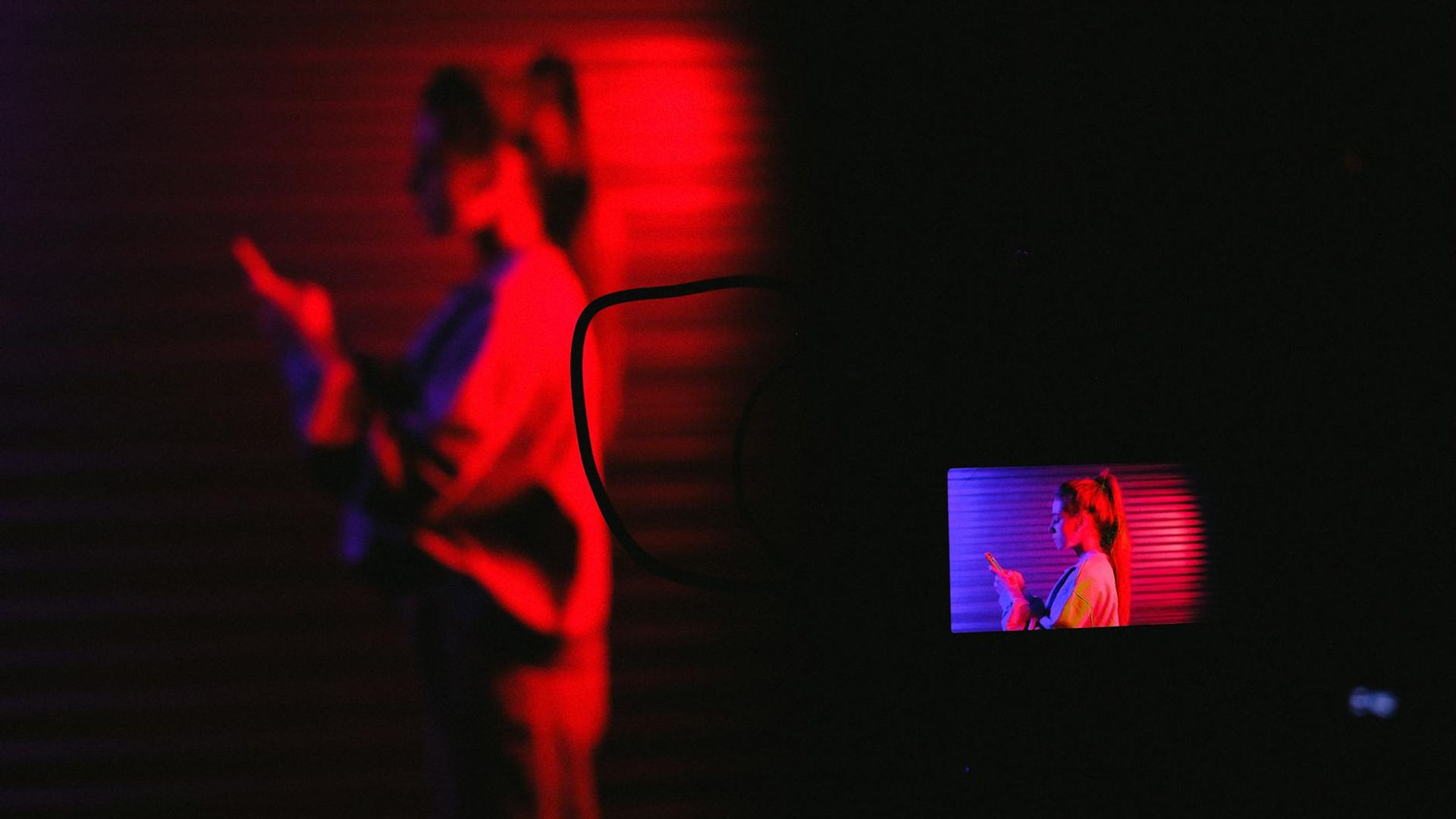Professional gym equipment with neon lighting in a dark room